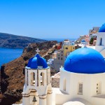 Panoramic view Santorini with blue domed church